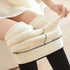 Plush leggings in black with a fleece lining are worn turned down with their inside showing - Fleece Chic