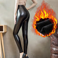 thermal leather leggings are worn by a woman in black heels and a thin light brown sweater - Fleece Chic